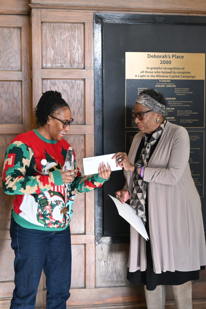 Christy Smith-Hall, Development Director of Deborah's Place, accepts the Alford-Axelson Award on behalf of Deborah's Place.