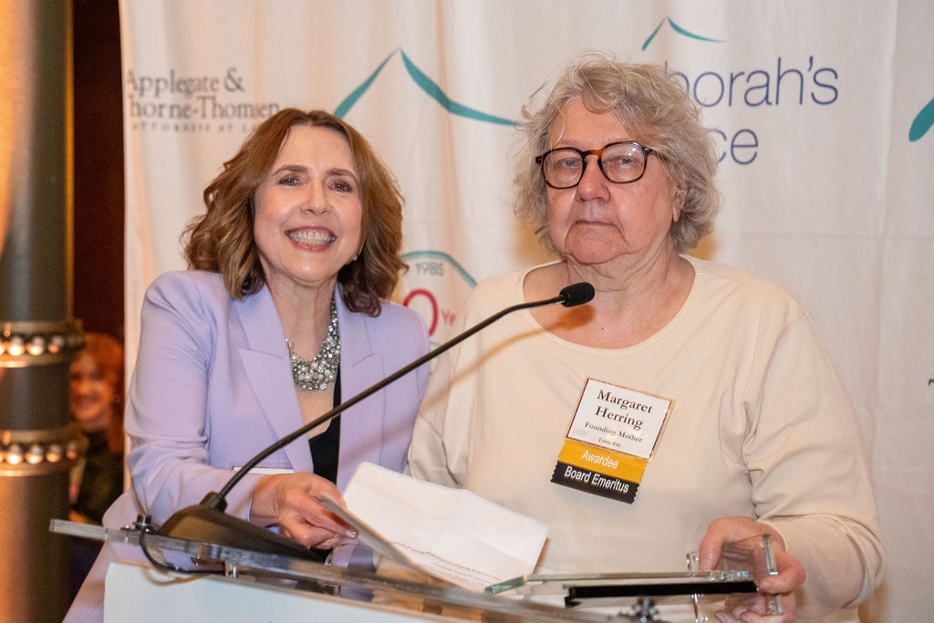 Maureen Milner presents an award to Margaret Herring at Opening Doors 2025: There's No Place Like Home, a fundraising event for Deborah's Place
