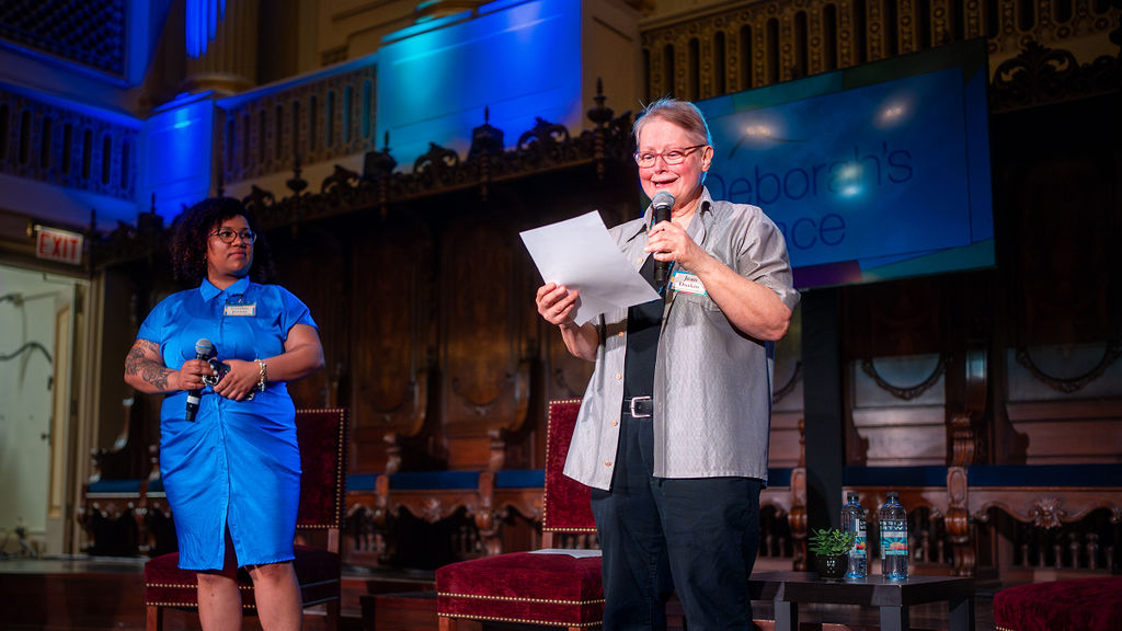 Staff members Cynthia Jordan and Jean Durkin speak at Opening Doors 2024 to raise money for Deborah's Place