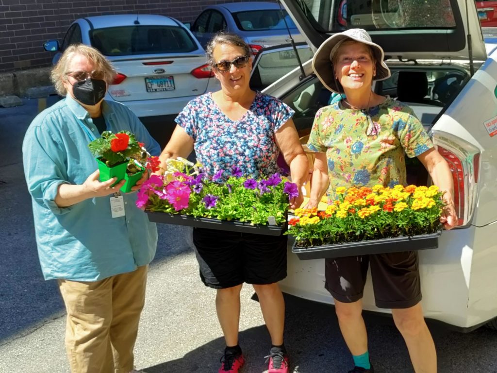Volunteers help to spruce up the garden at Deborah's Place in Chicago